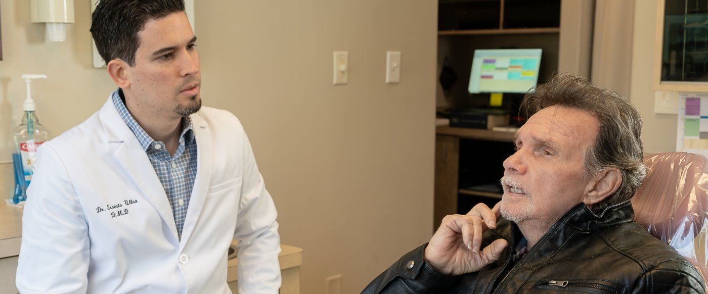 Durham emergency dentist talking to a patient in the dental chair