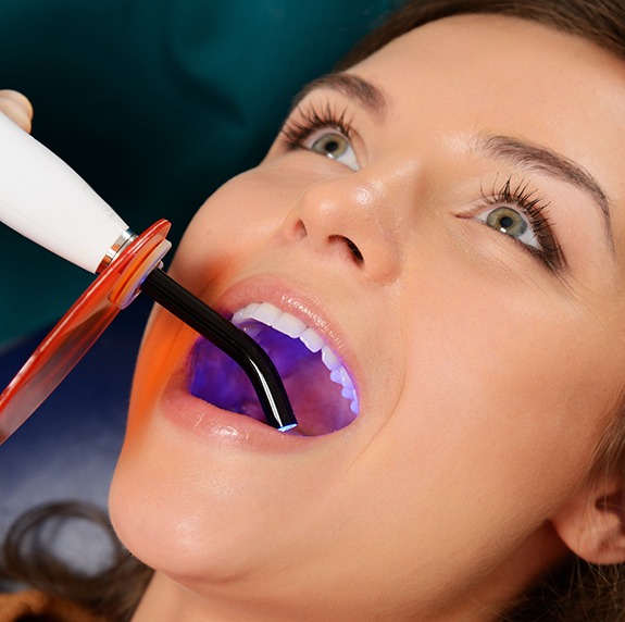 Dental patient receiving tooth-colored filling